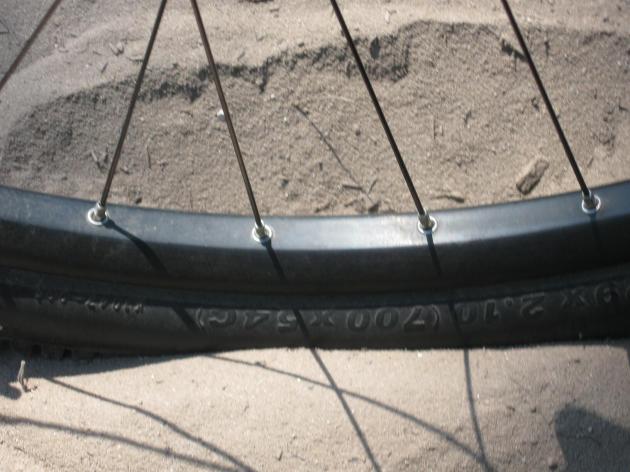 My tire in the sand of Osmun Road