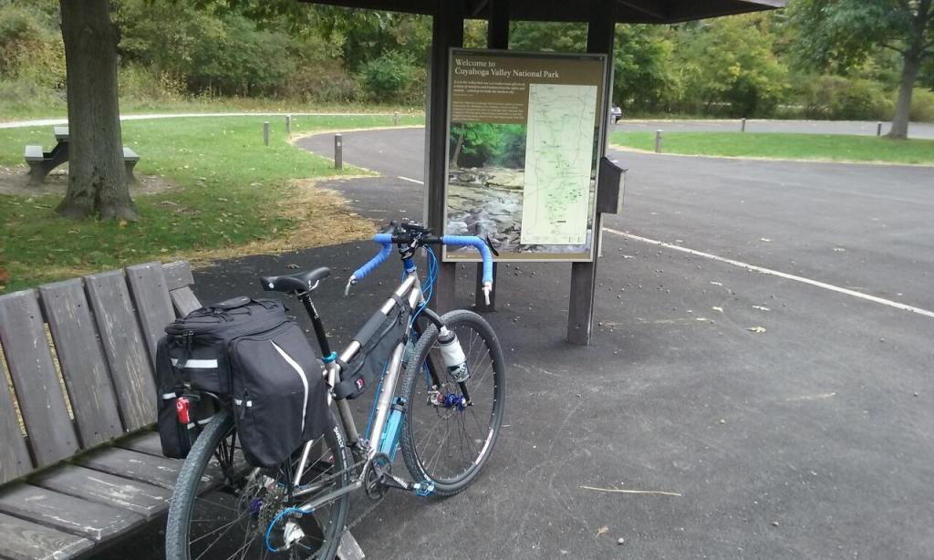 A bicycle leaning on a kiosk at a trailhead for the Ohio & Erie Canal Towpath Trail
