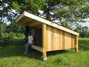 Adirondack-style camping shelter at Heritage Farms in Peninsula.